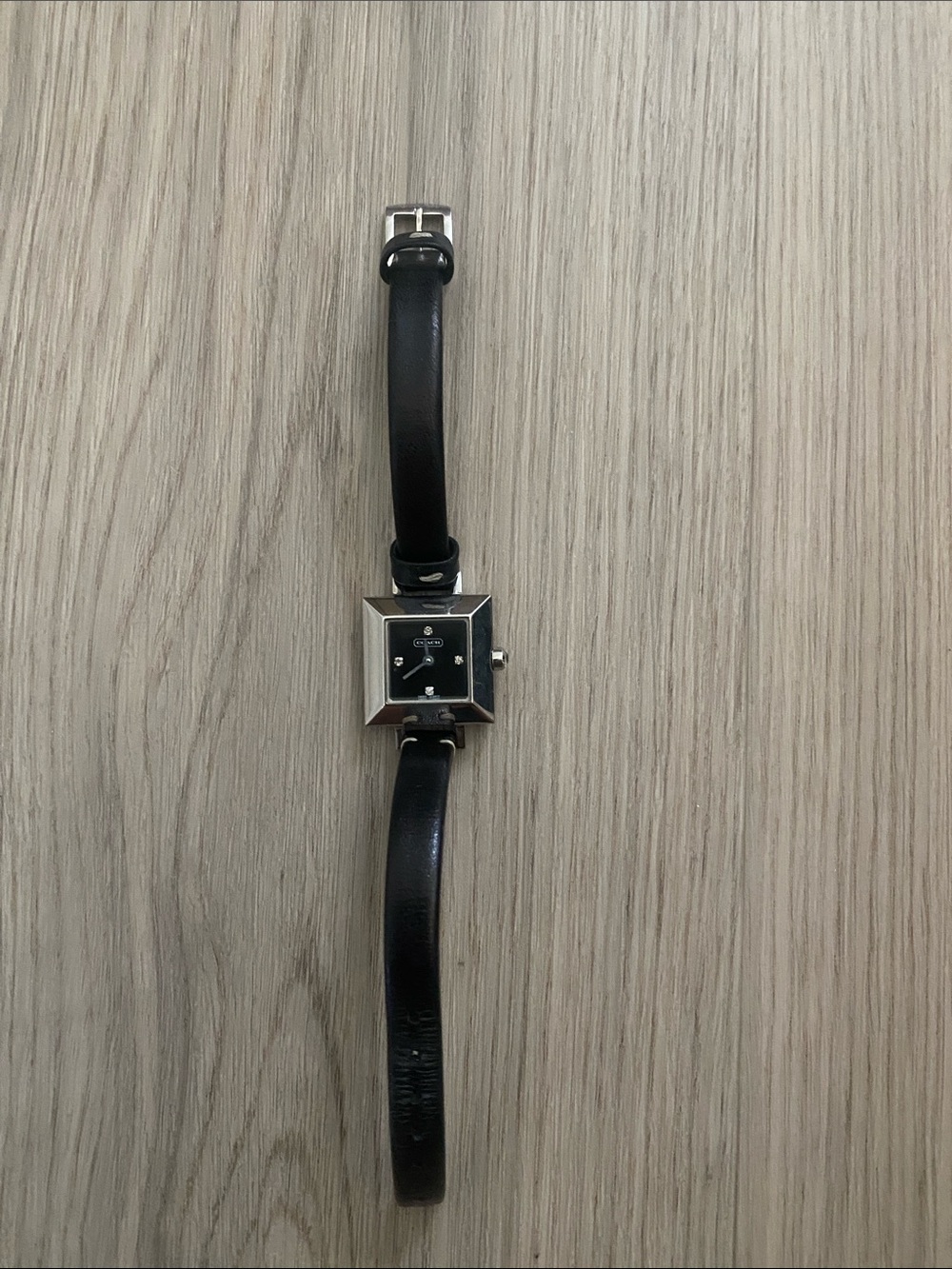 Coach woman’s  Black Leather Strap Watch with Square Silver Case